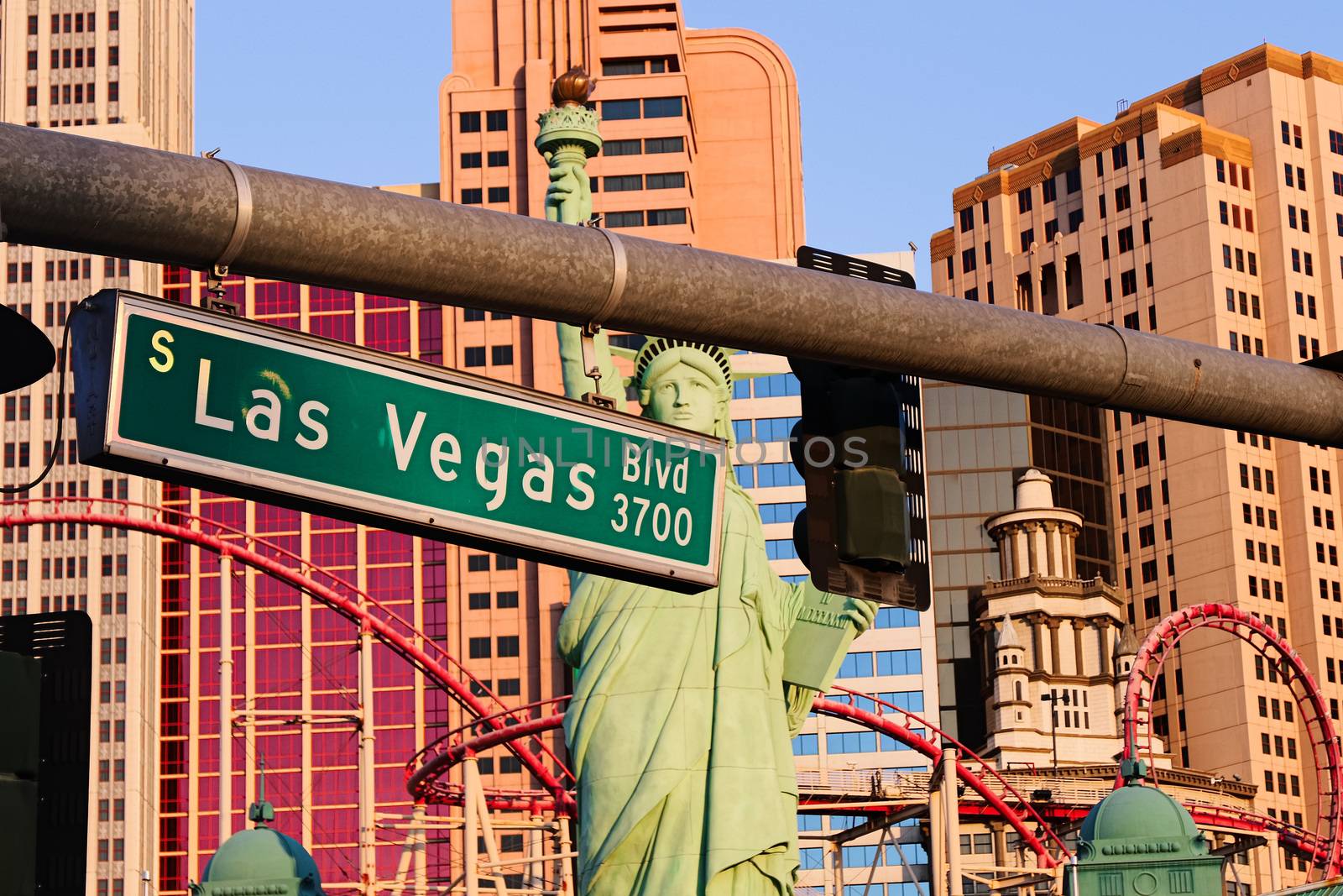 Road sign of Las Vegas BLVD.Street sign of Las vegas Boulevard.Green Las Vegas Sign with Hotel in Background.