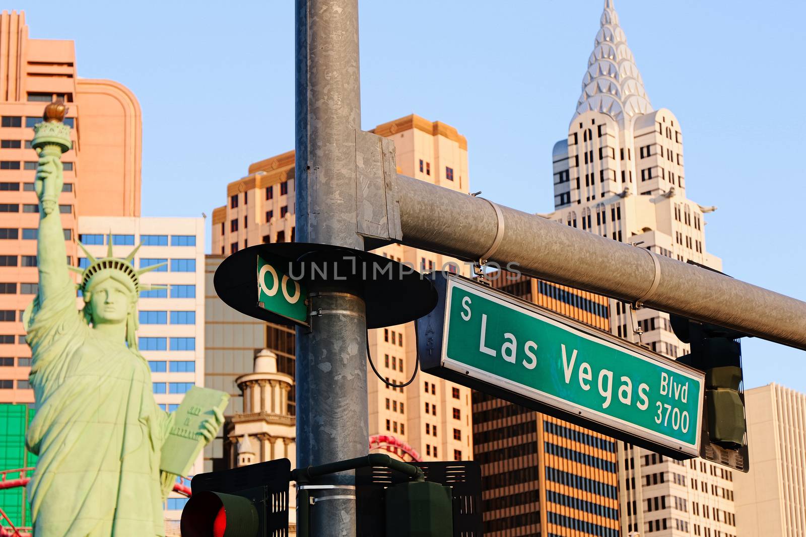 Road sign of Las Vegas BLVD.Street sign of Las vegas Boulevard.Green Las Vegas Sign with Hotel in Background. by USA-TARO