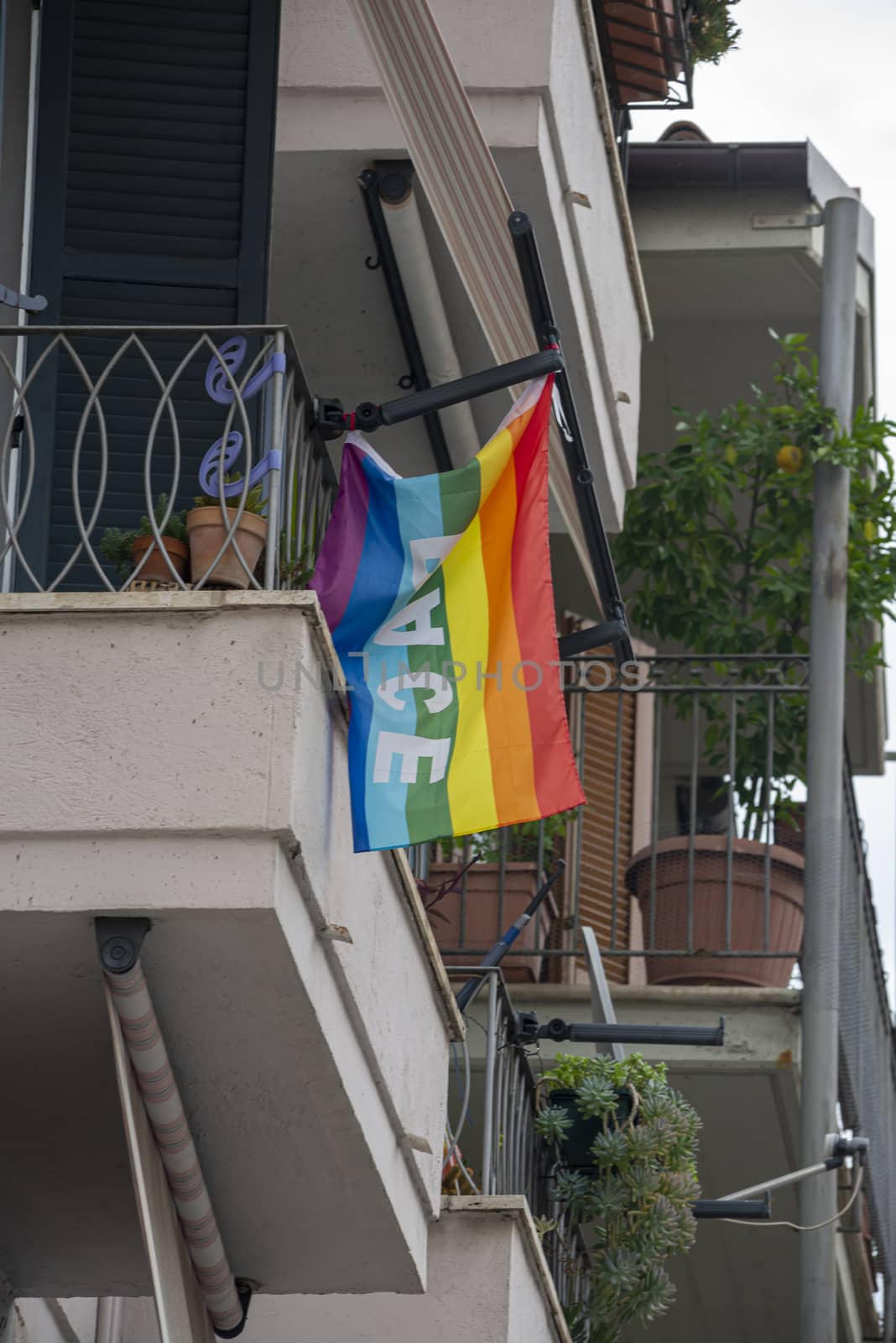 terni,italy september 02 2020:peace flag placed on a balcony of a house