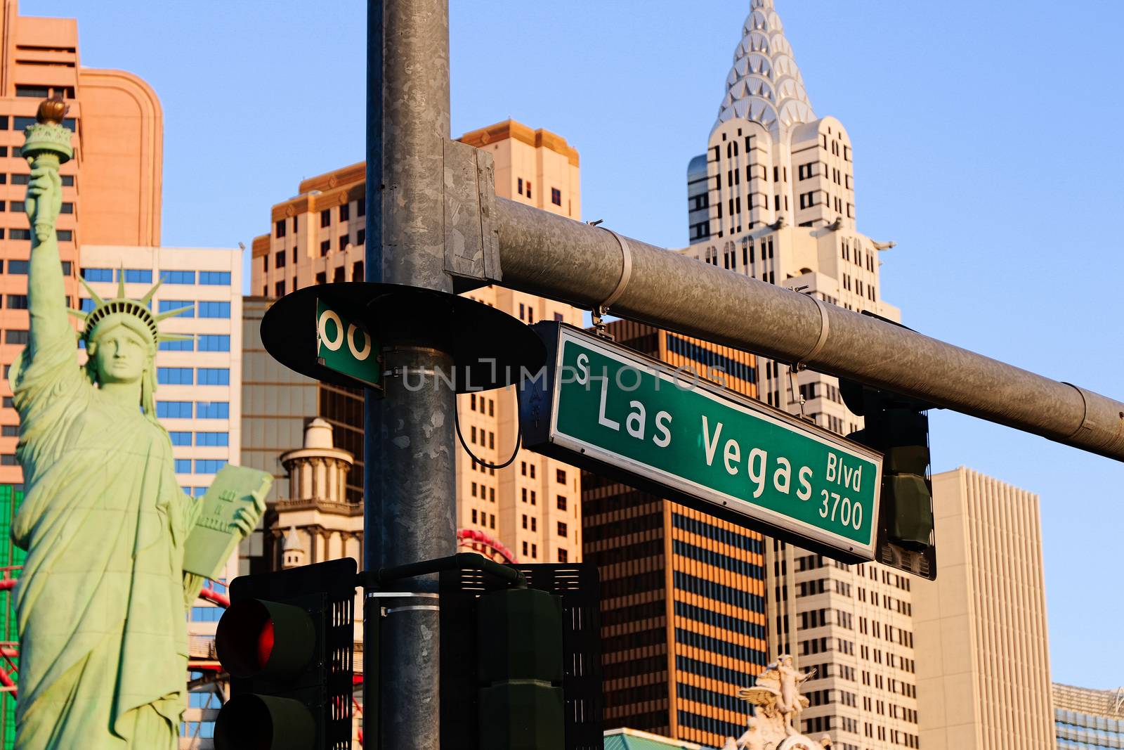 Road sign of Las Vegas BLVD.Street sign of Las vegas Boulevard.Green Las Vegas Sign with Hotel in Background.