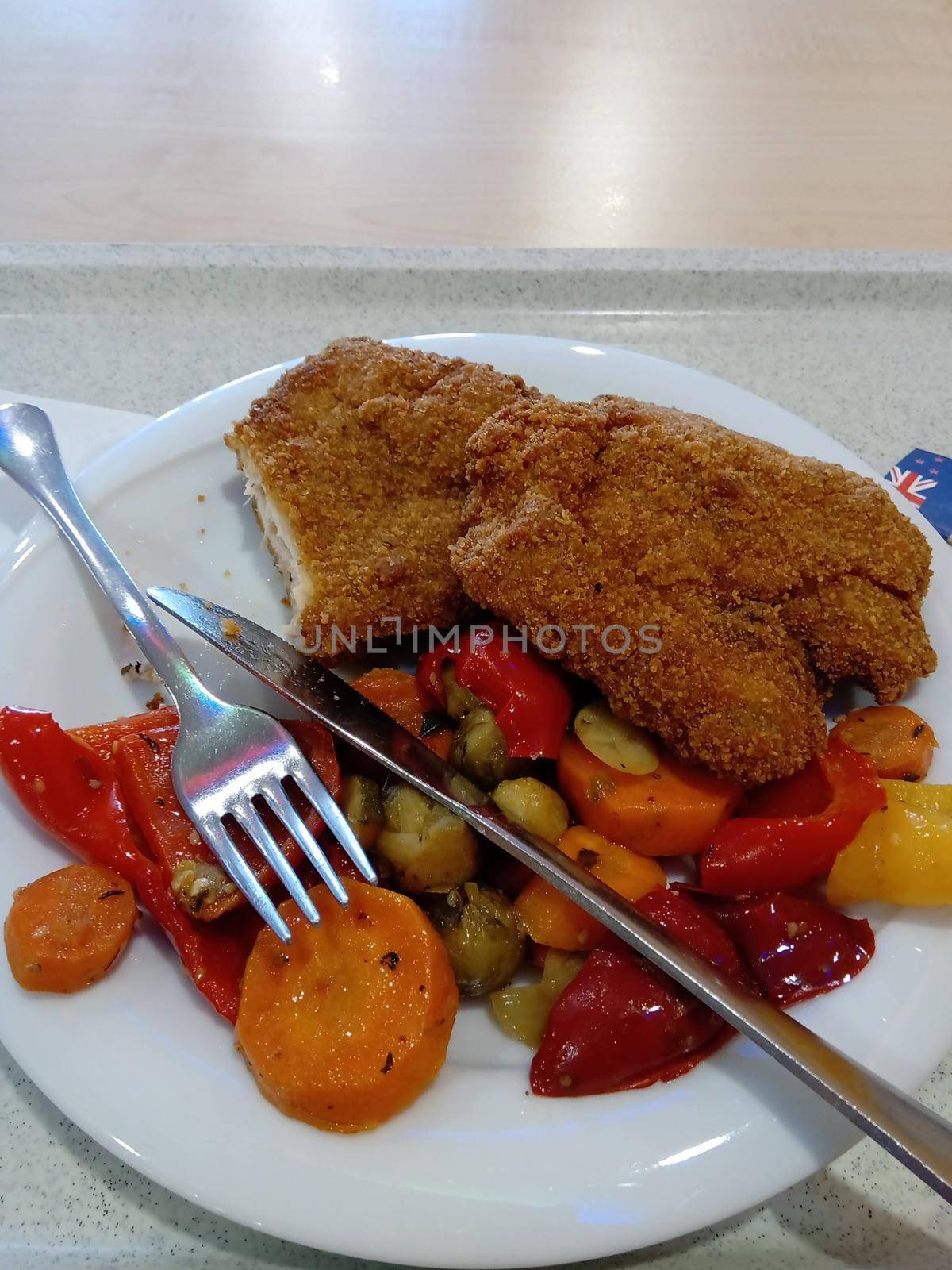 Fried turkey breast, served with grilled vegetables. High quality photo