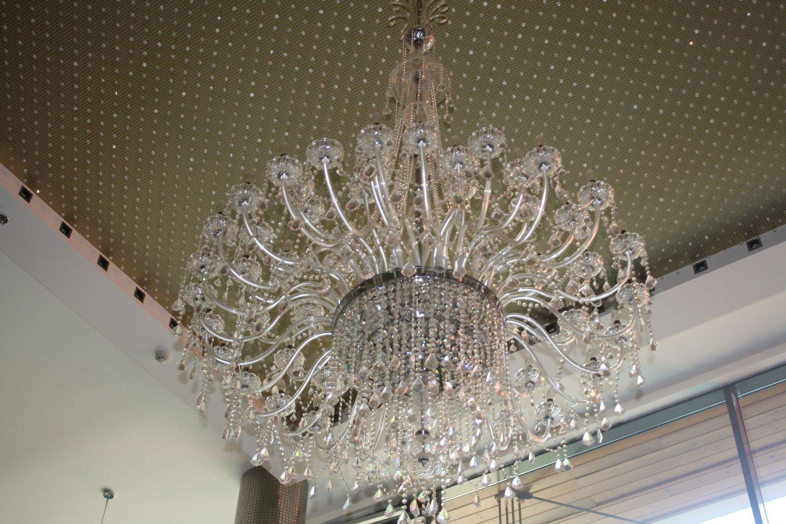 A chandelier hanging from the ceiling. High quality photo