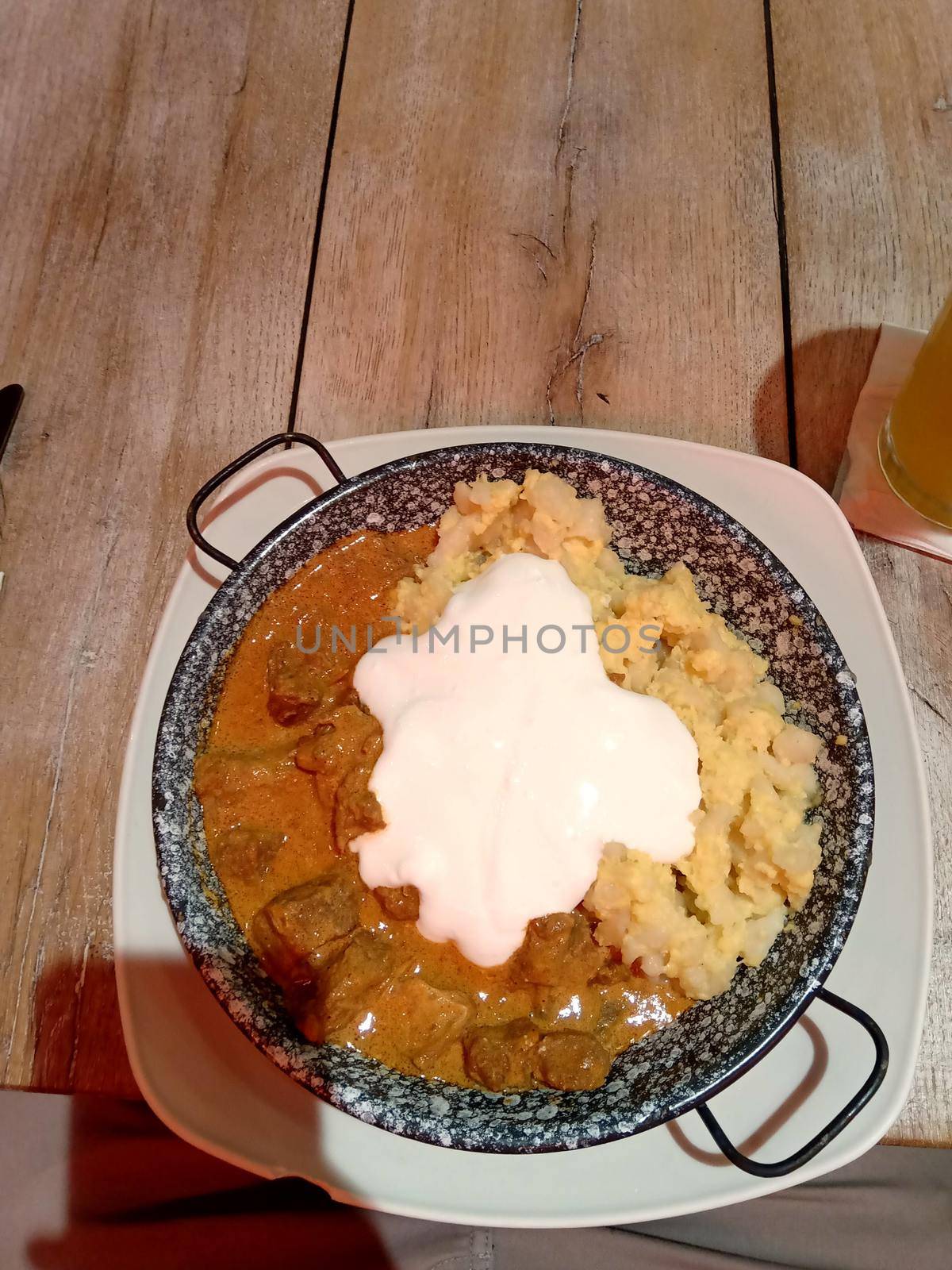 Cottage cheese with veal stew and large portions of sour cream. High quality photo