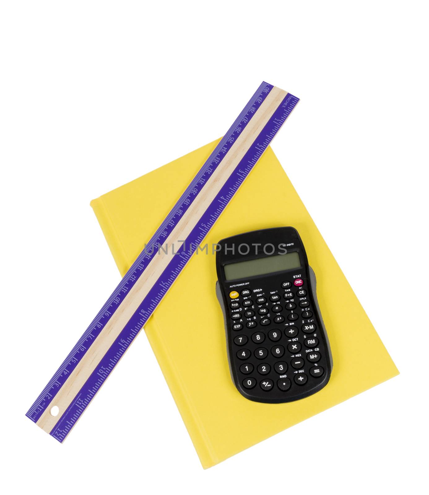 Nice shot of a purple ruler and calculator resting on a bright yellow colored book isolated on white background.