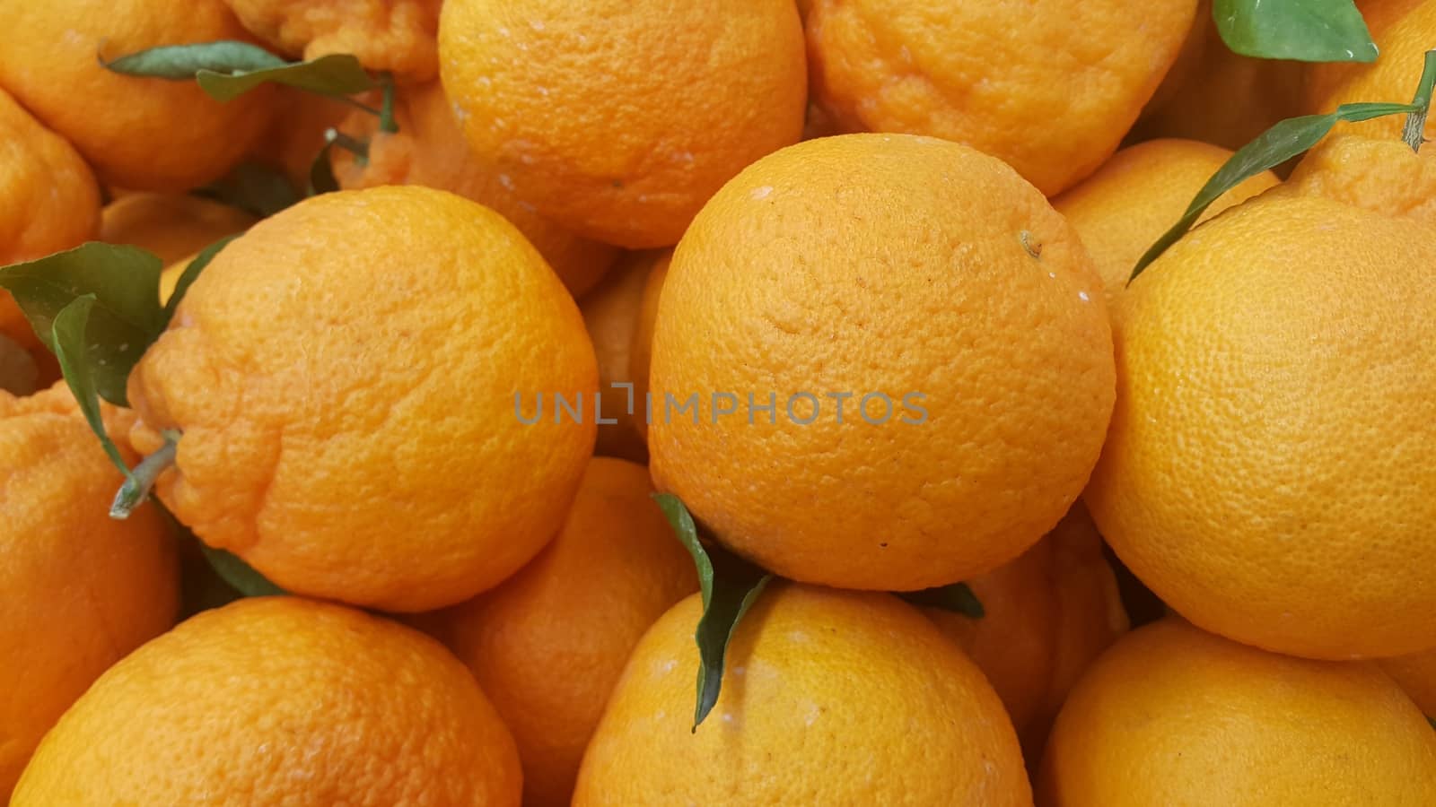 Healthy, fresh organic oranges in supermarket for sale, pile of orange in market for texture