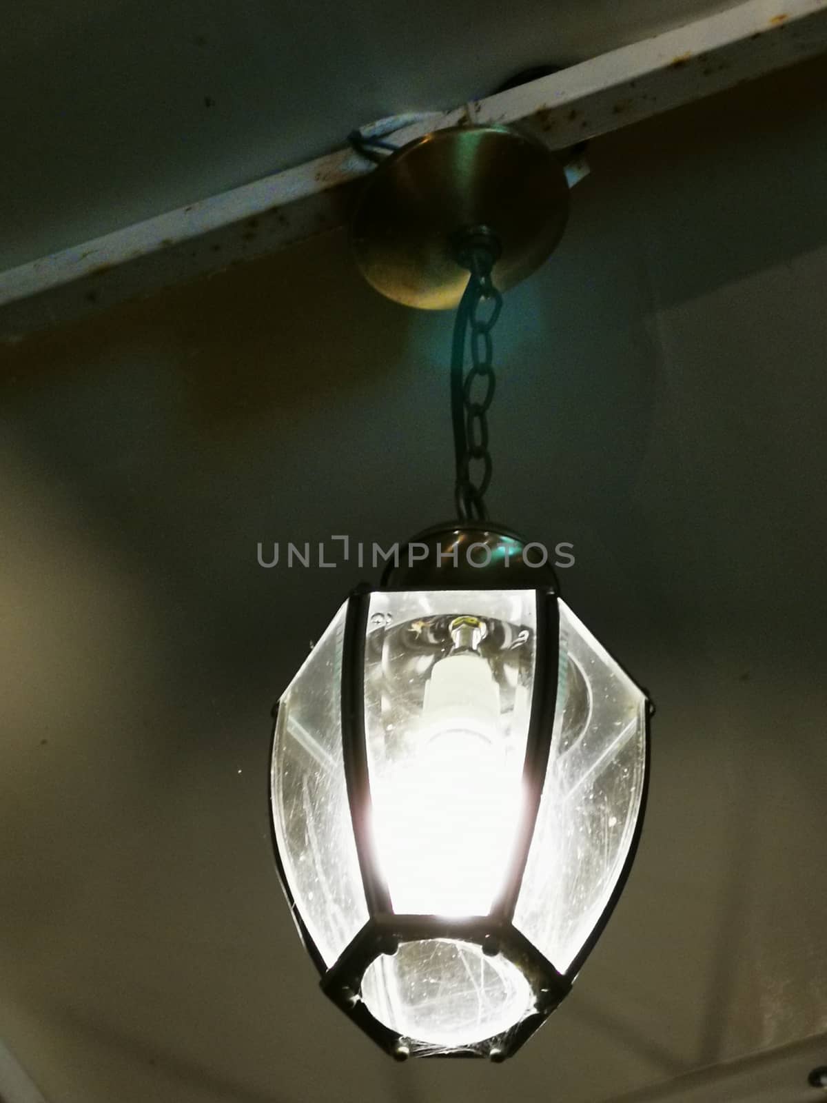 A lamp hanging from the ceiling. High quality photo
