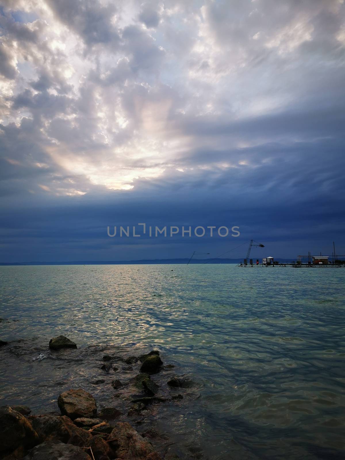Clouds in the sky over a body of water. High quality photo