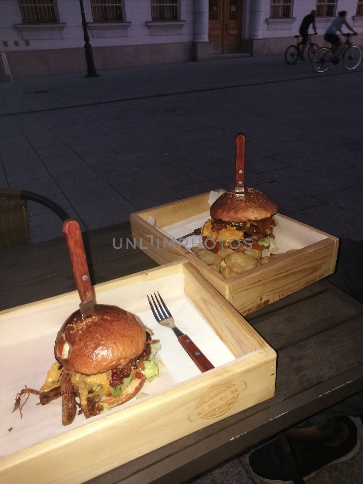 A sandwich sitting on top of a wooden table. High quality photo