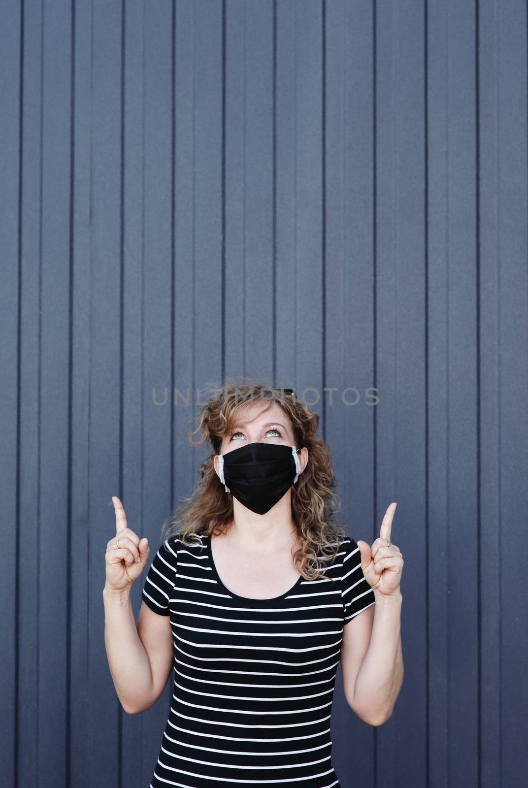 Portrait of a Girl in a protective mask, free space for text. by selinsmo