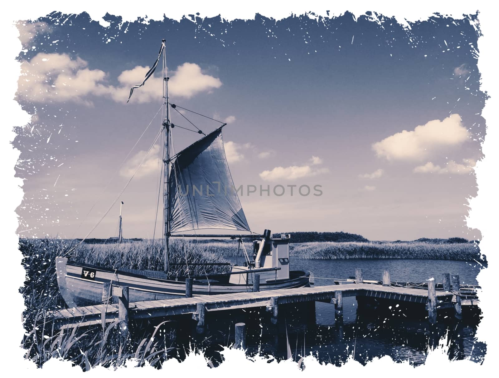 Lone boat on the riverbank with postcard frame high quality photo