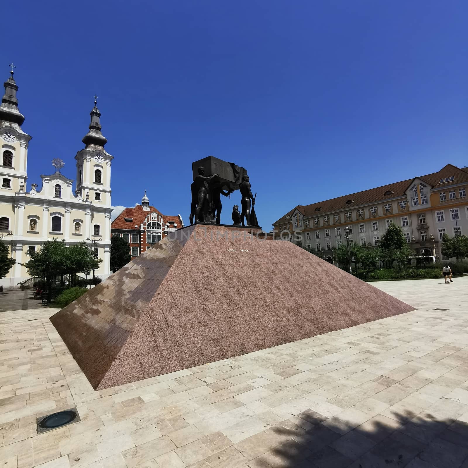 View of the Church of Miskolc and the beautiful statue in the city centre. High quality photo