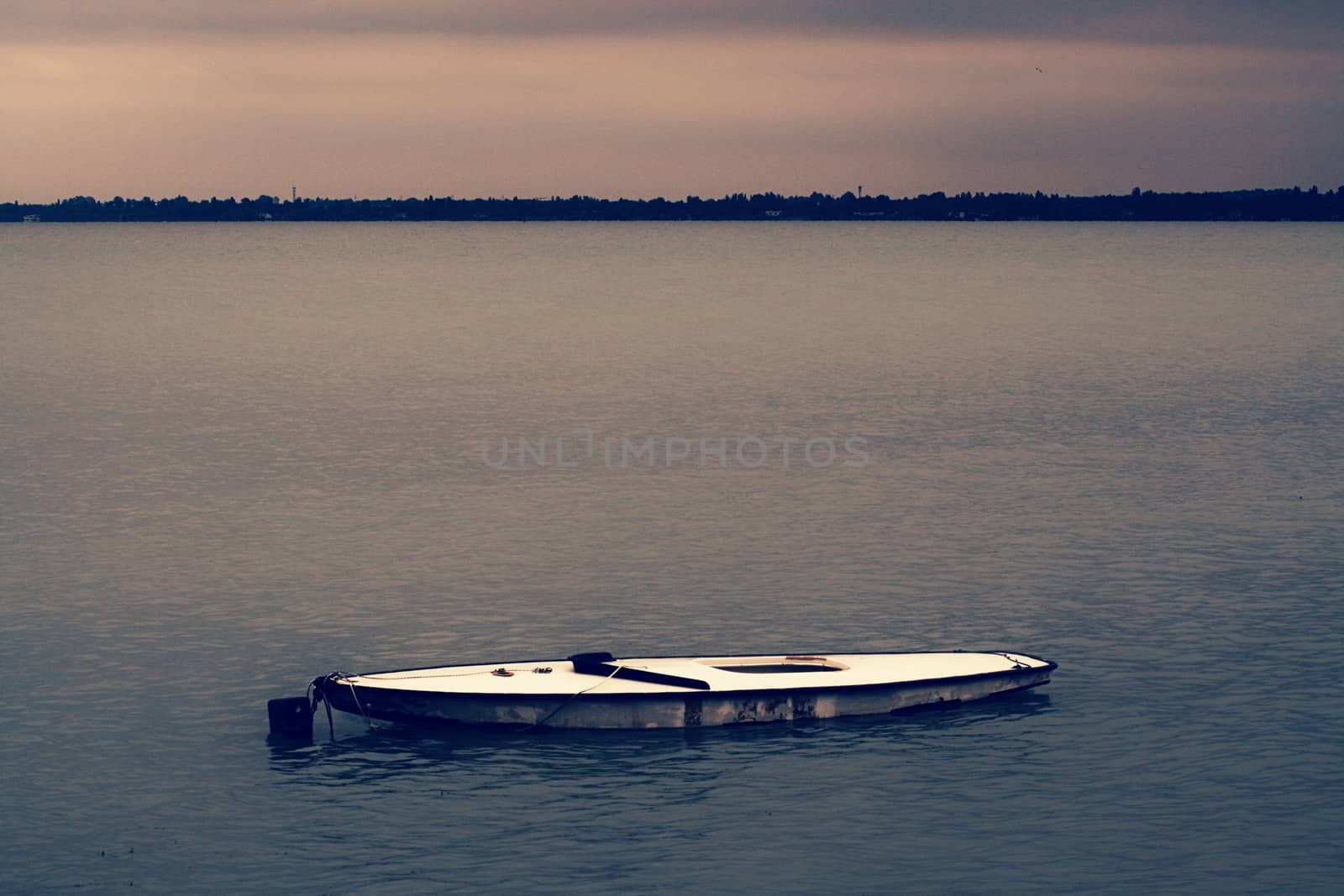 A small boat in a large body of water by balage941