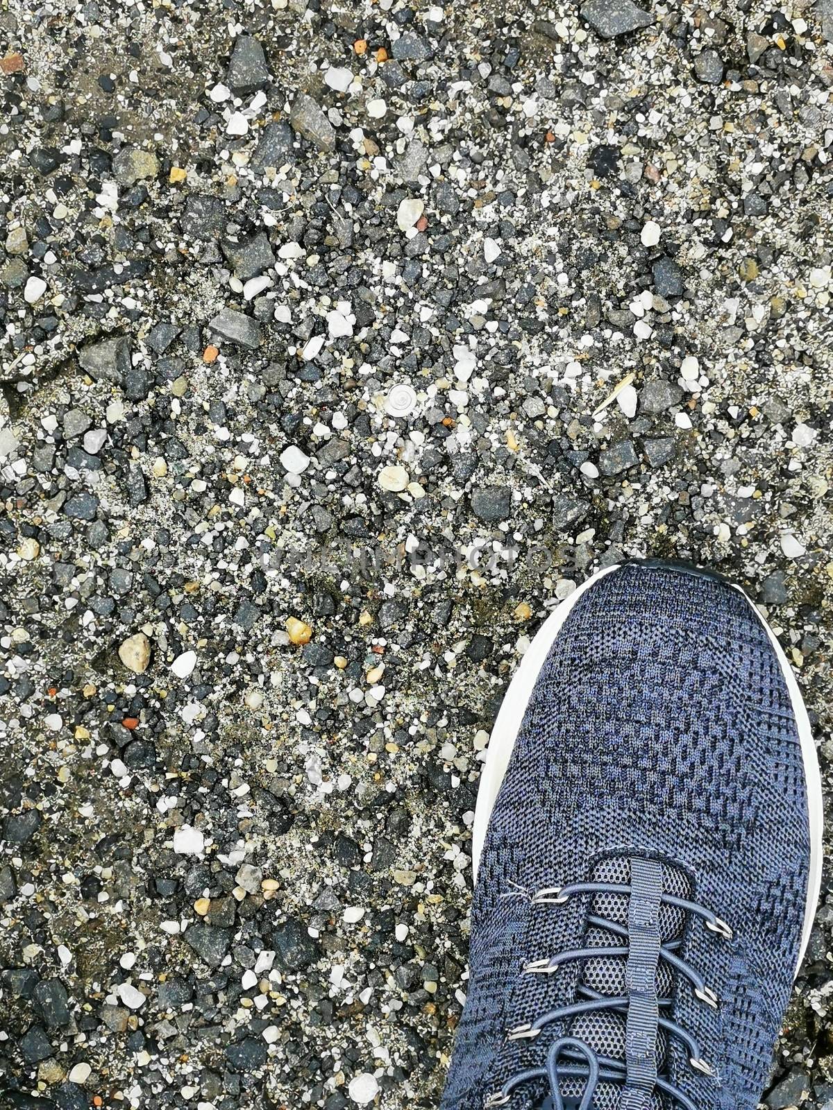 A close up of feet wearing blue shoes. High quality photo