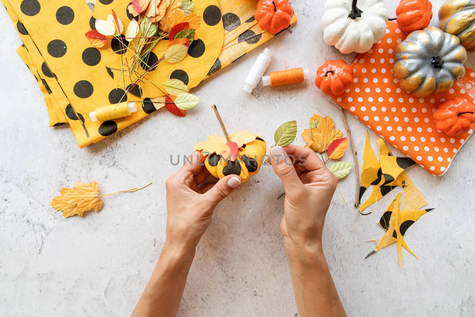 Step by step instruction of making halloween textile DIY pumpkin craft. Step 7 - decorate the top of pumpkin with autumn leaves by Desperada