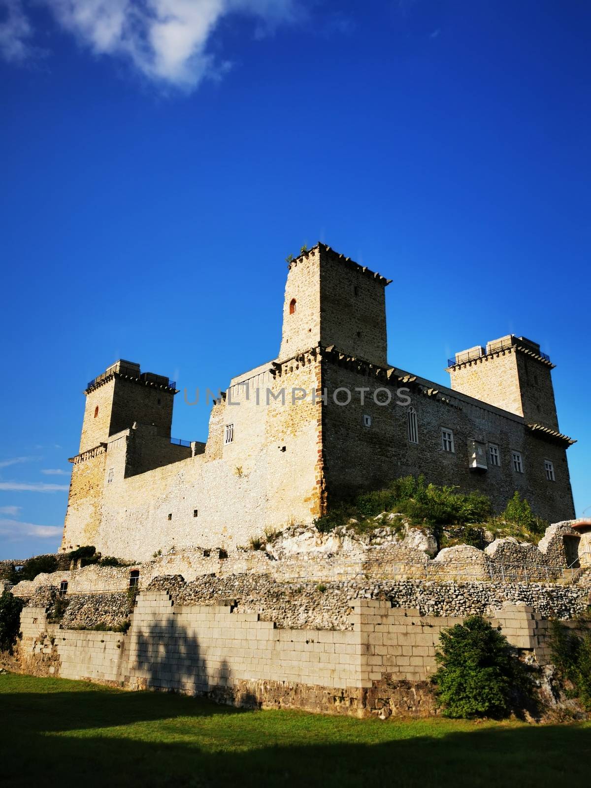 A castle on top of a stone building. High quality photo