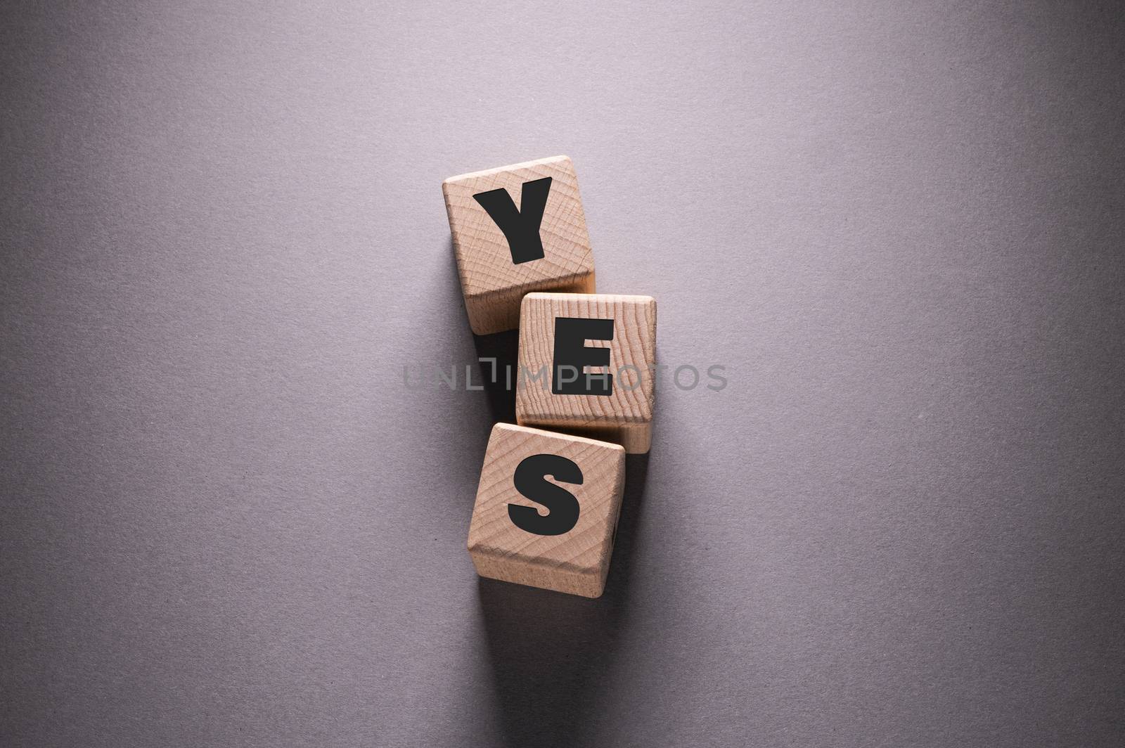 YES Word Written on Wooden Cubes