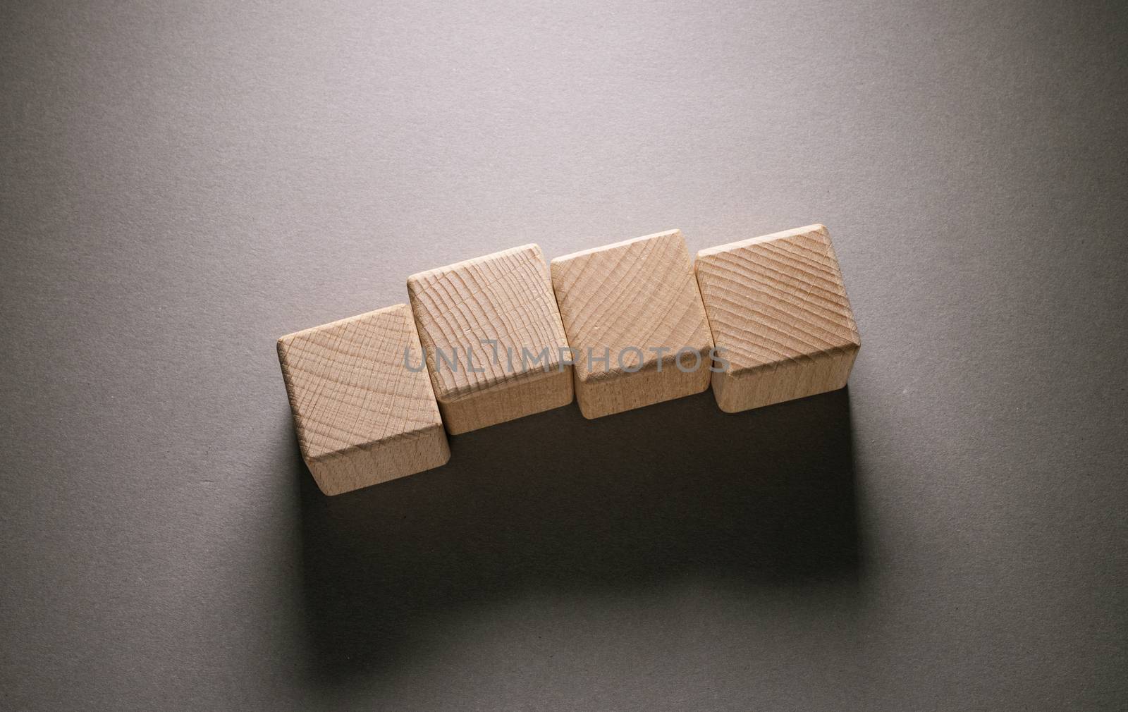 Wooden Geometric Shapes Cube on a paper background , This can use for past your words