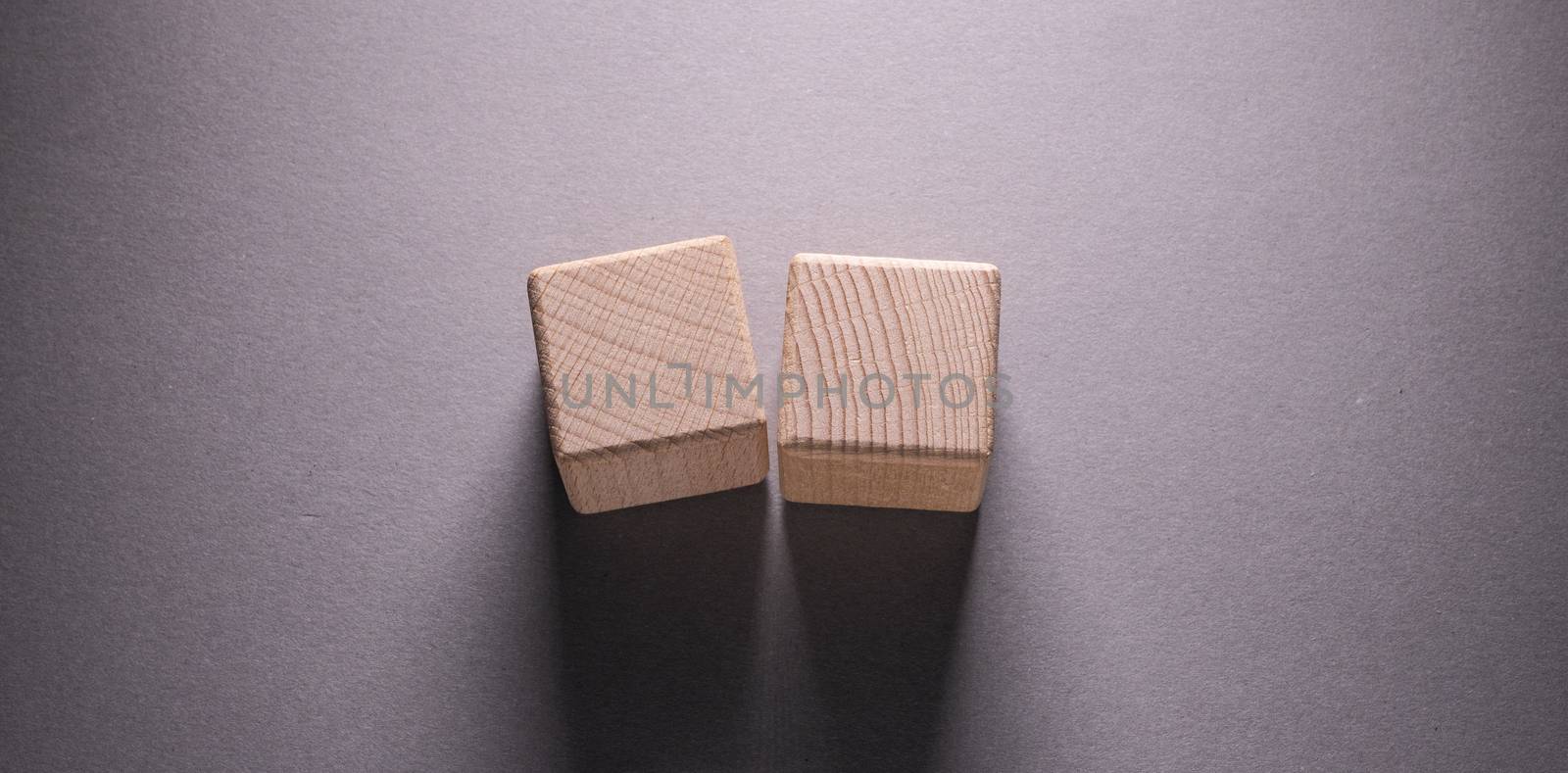 Wooden Geometric Shapes Cube on a paper background , This can use for past your words