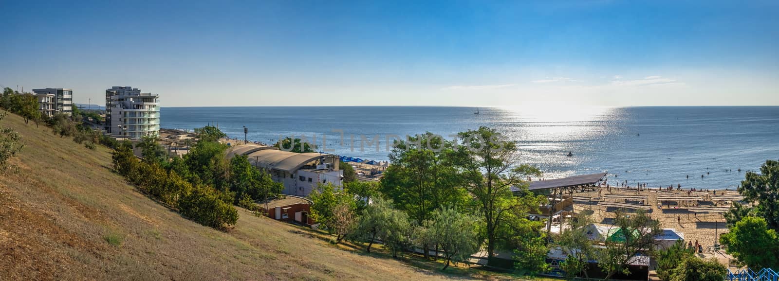 Chernomorsk, Ukraine 08.22.2020. Panoramic view of the Public beach in Chernomorsk city on a sunny summer morning