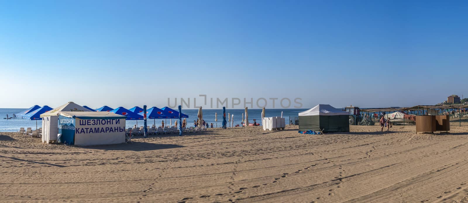 Chernomorsk, Ukraine 08.22.2020. Panoramic view of the Public beach in Chernomorsk city on a sunny summer morning