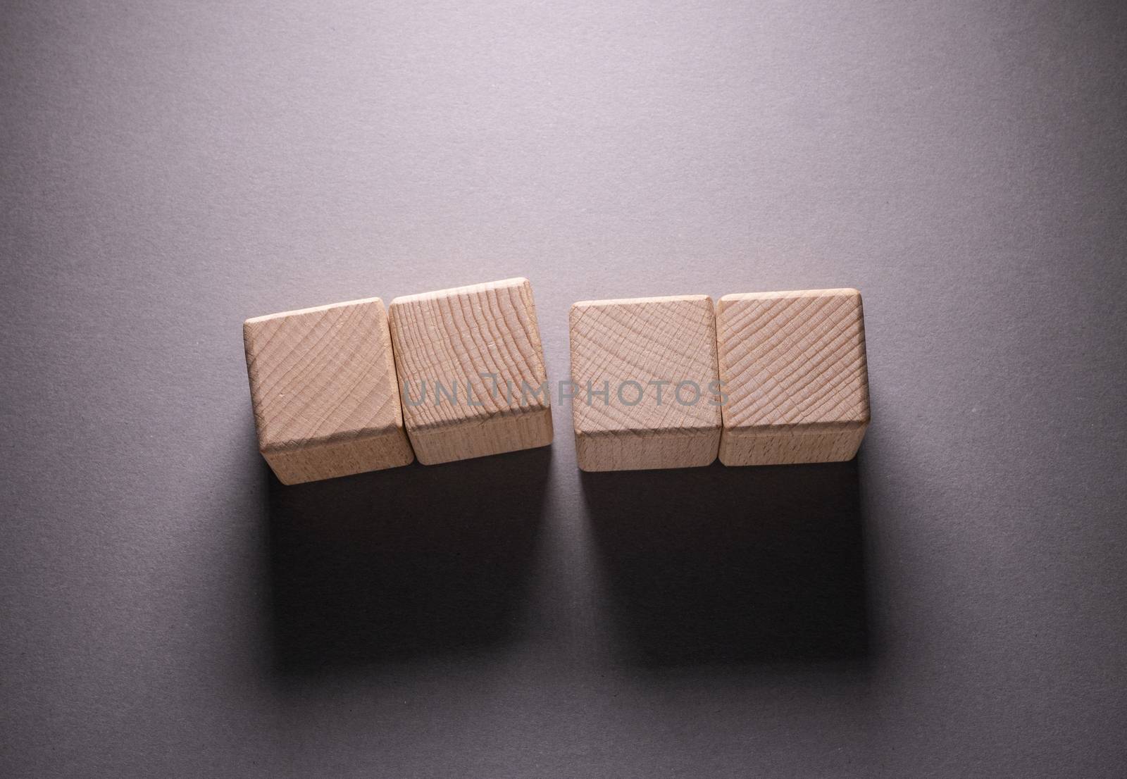 Wooden Geometric Shapes Cube on a paper background , This can use for past your words