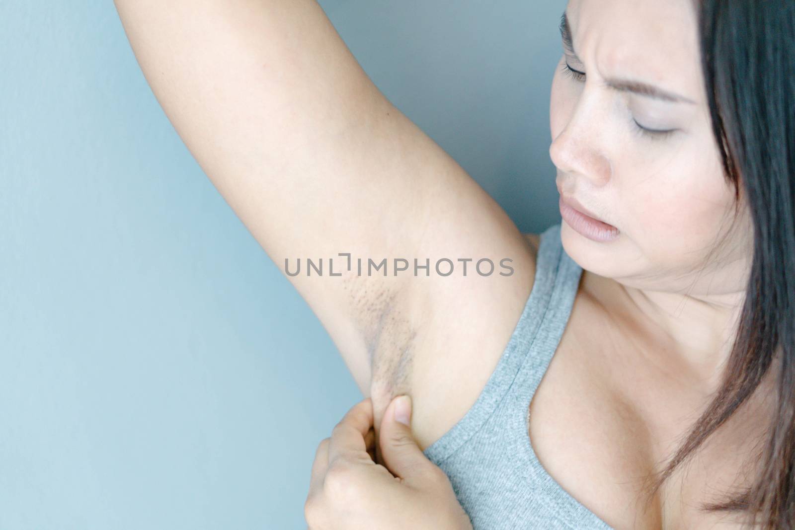 Women problem black armpit with grey background for skin care an by pt.pongsak@gmail.com