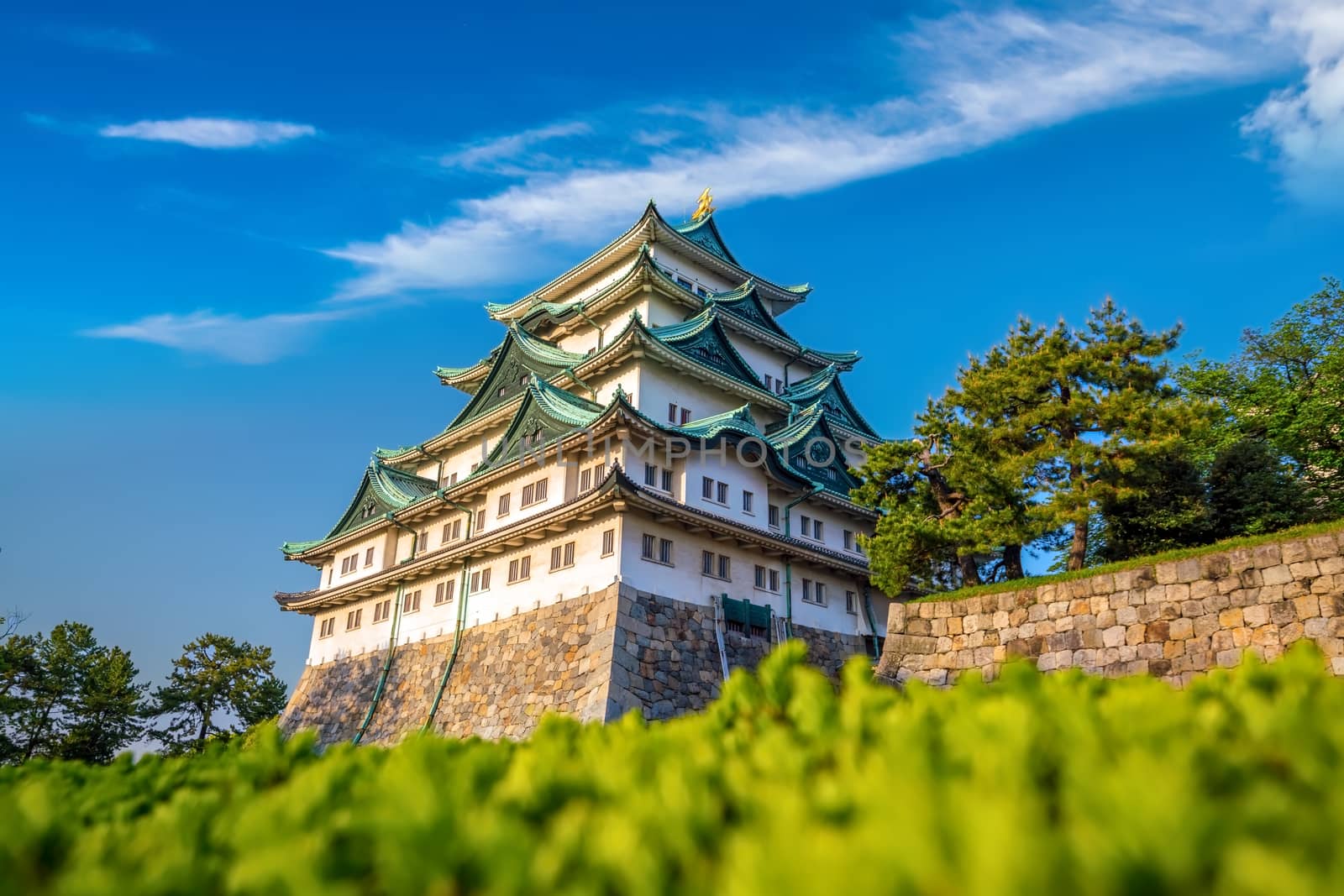 Nagoya Castle and city skyline in Japan by f11photo