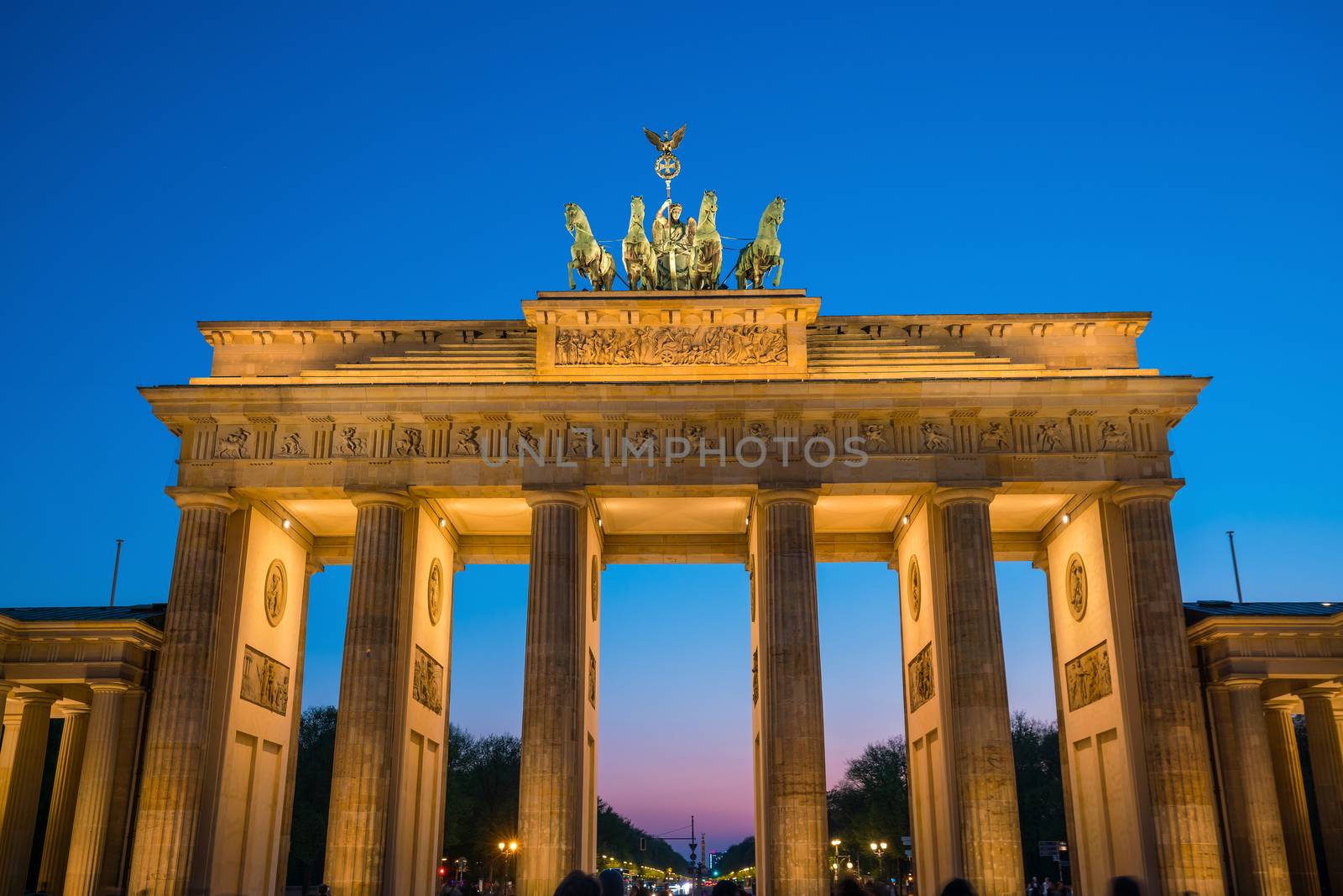 The Brandenburg Gate in Berlin at night by f11photo