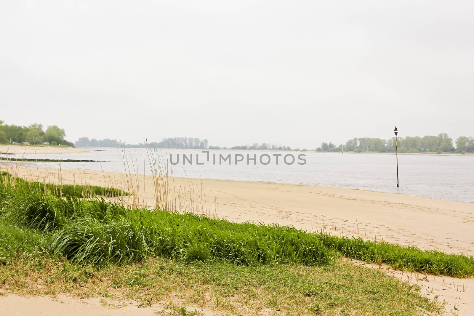 Rough and cold Weser beach Brake Unterweser Lower Saxony Germany. by Arkadij