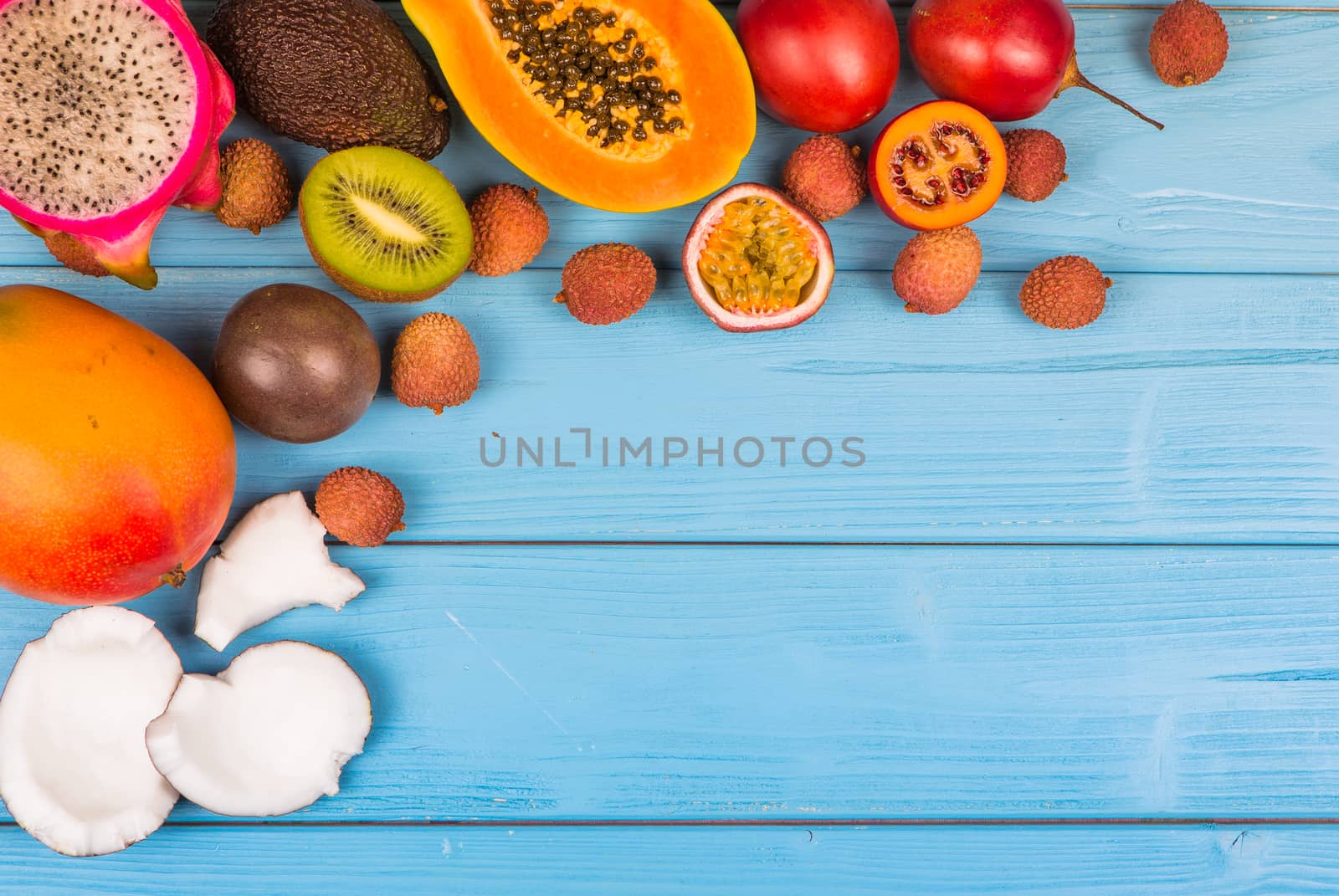 Multifruit Fresh ripe on blue wooden background