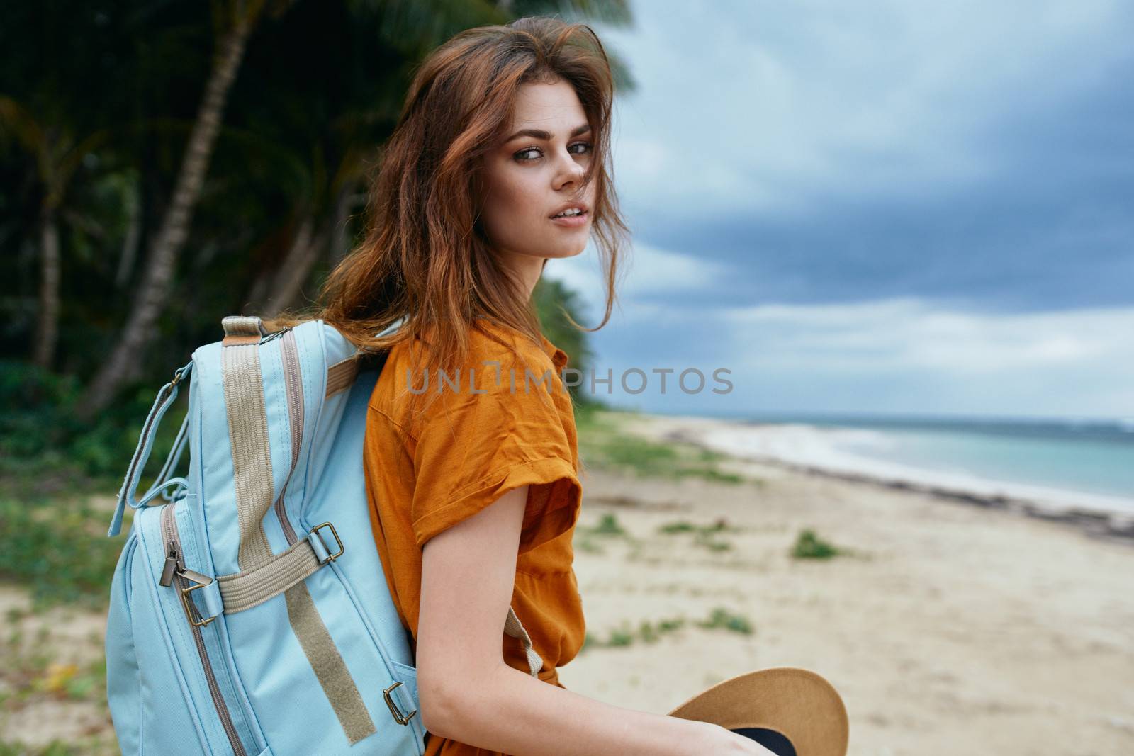Woman tourist blue backpack walk travel adventure by SHOTPRIME