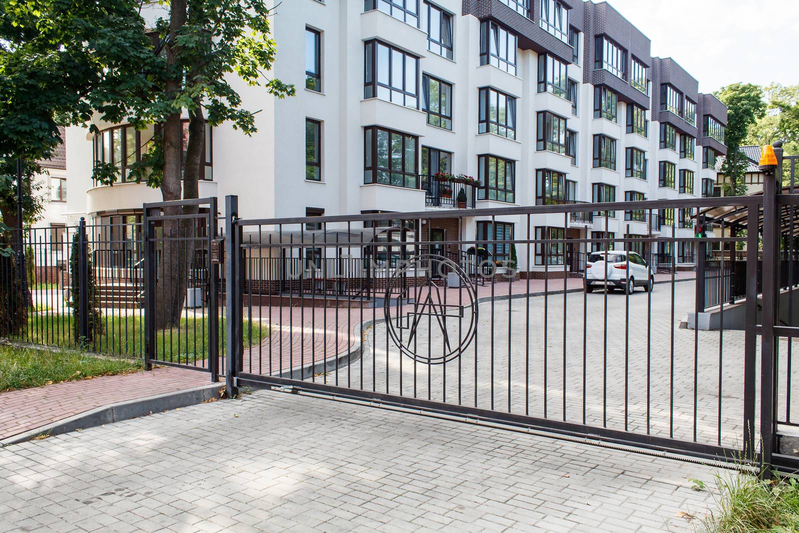 new house with plastic windows and doors in a residential area on summer day