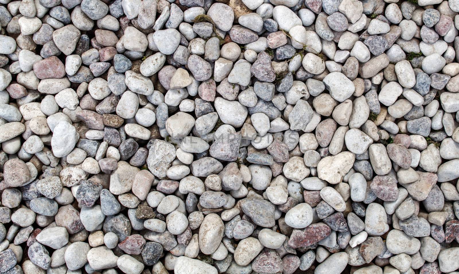 small stones of different sizes and colors. ideal as nature background. 