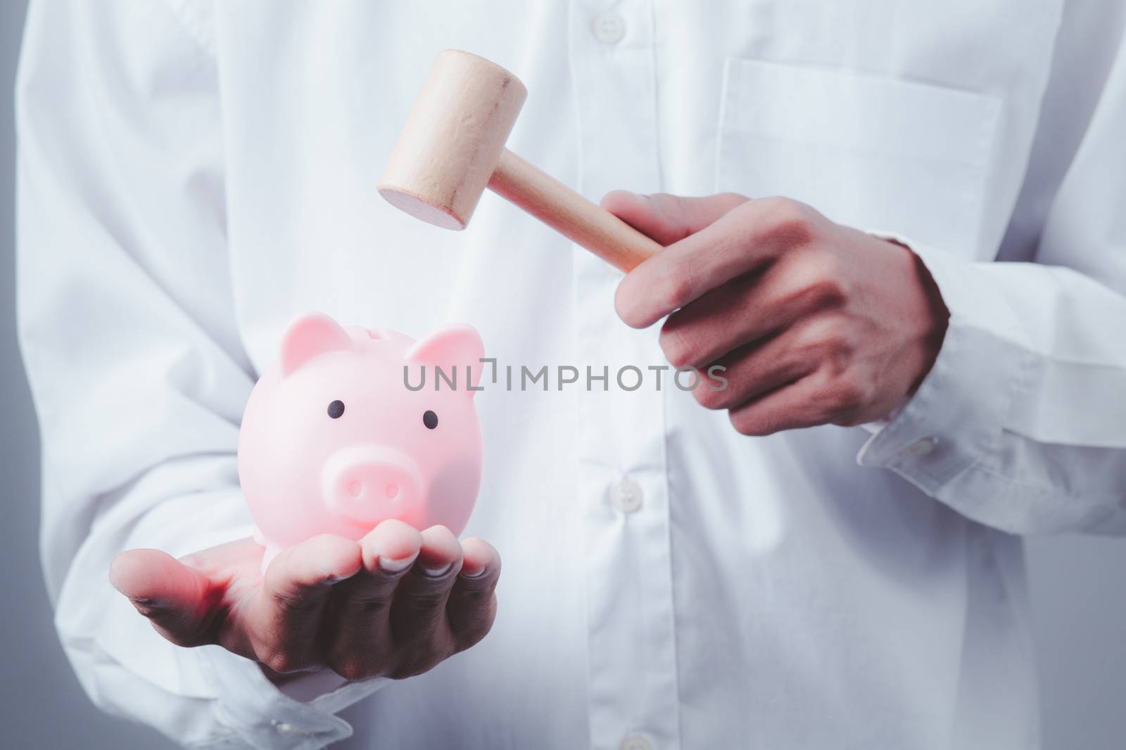 Hand of kid holding coin put in piggy bank with money stack grow by golfmhee