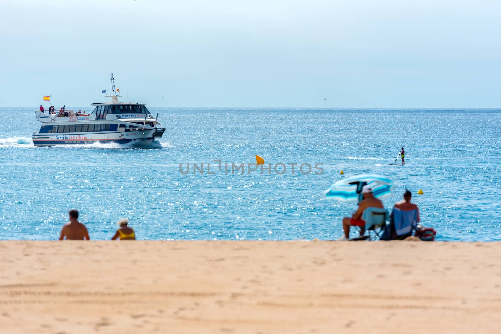 Lloret de Mar, Spain : 2020 2 Sept : Boat in the beach of Lloret de Mar after Covid 19 without international tourists in summer 2020