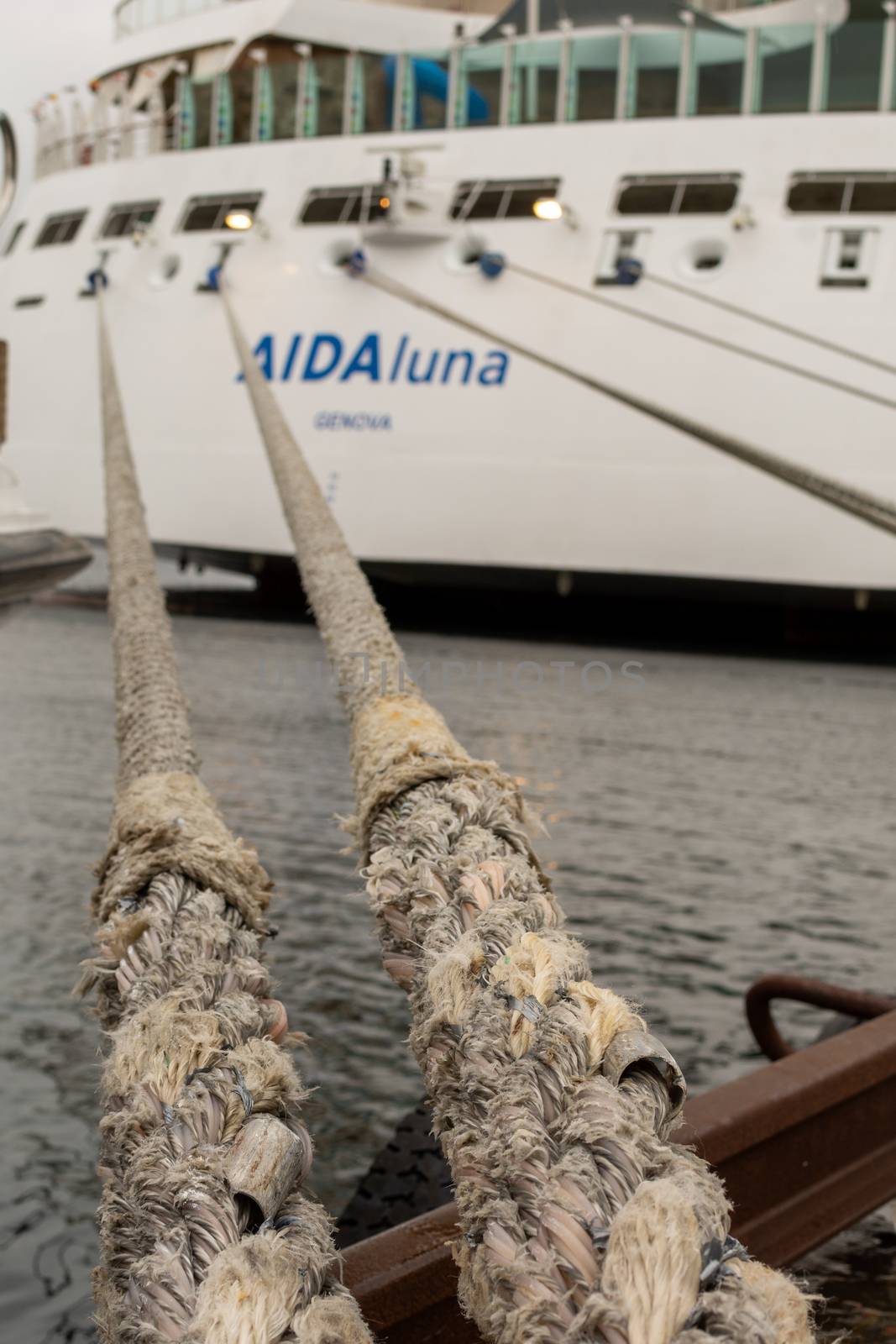 Stavanger, Norway, May 2015: Aida Luna cruise ship moored in the harbor, ropes pulling the ship to quay. Selective Focus.