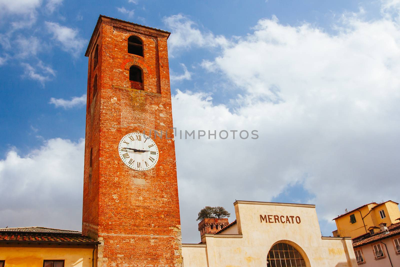 Lucca, Italy - March 3rd 2008: Beautiful historic architecture of Mercato del Carmine and church of Santa Maria del Carmine in Lucca Italy on a cool winter's evening
