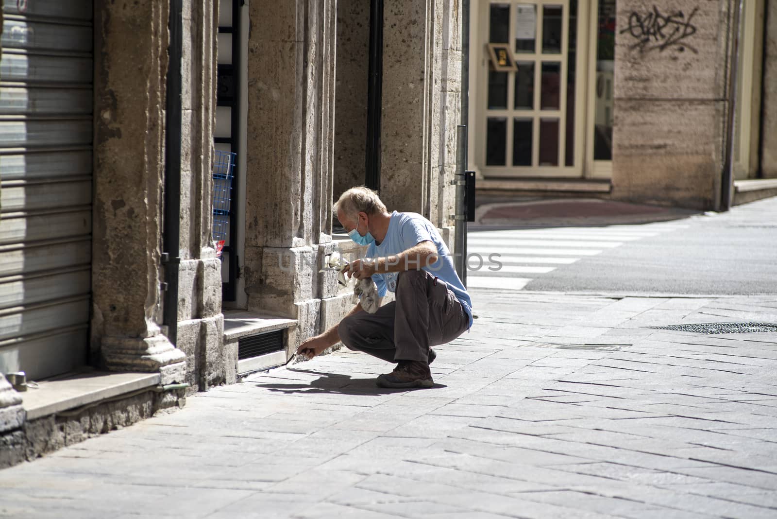 terni,italy september 02 2020:house painter at work on a shop