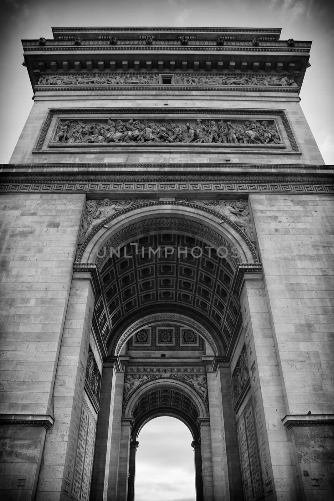 The historic Arc de Triomphe in black and white detail in Paris, France