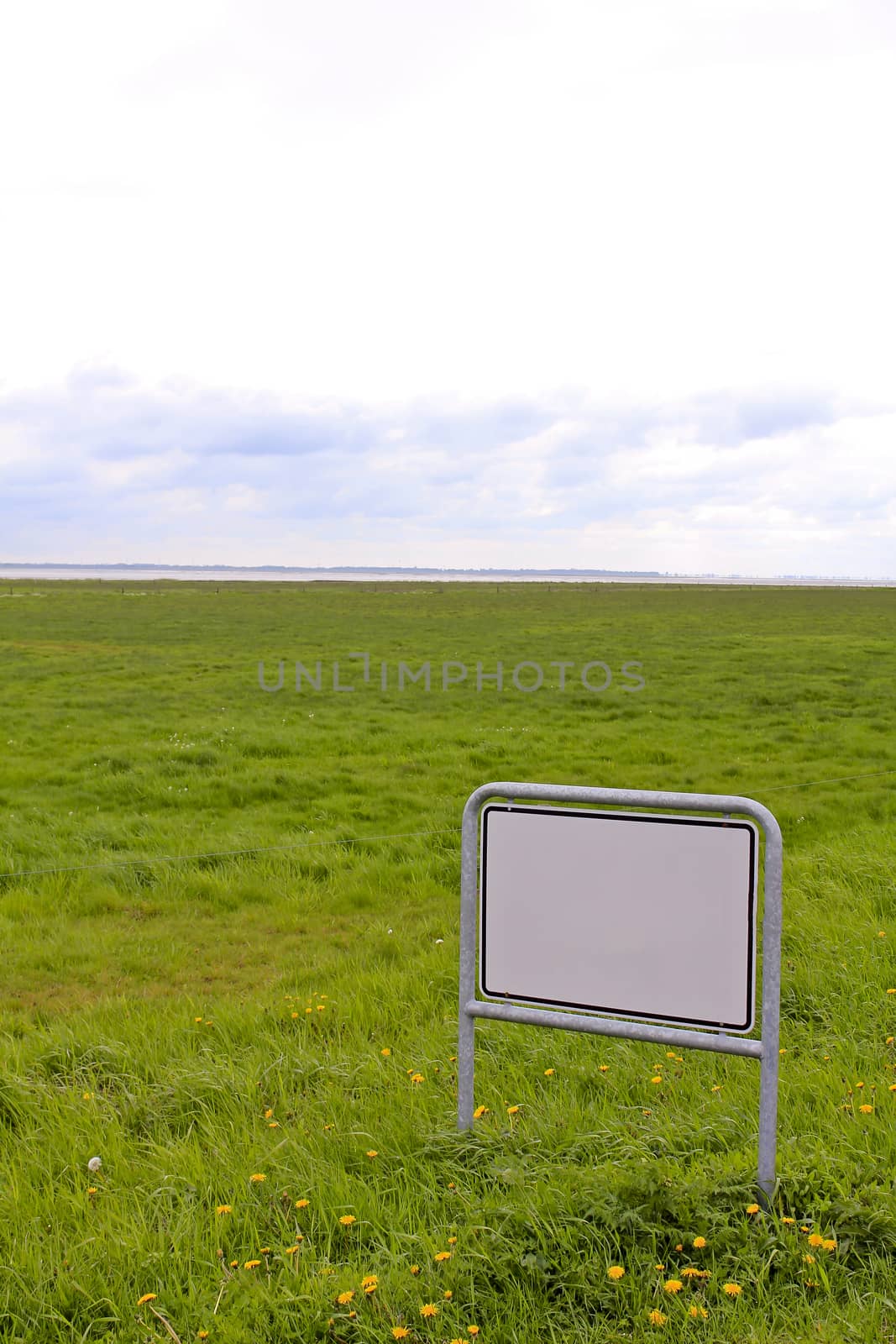 Blank white road traffic sign in the bog area of ​​northern Germany.