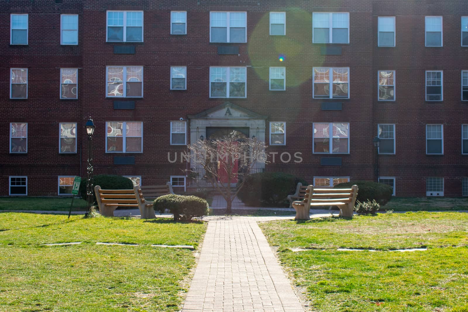 The Courtyard of a Brick Apartment Building on a Sunny Day