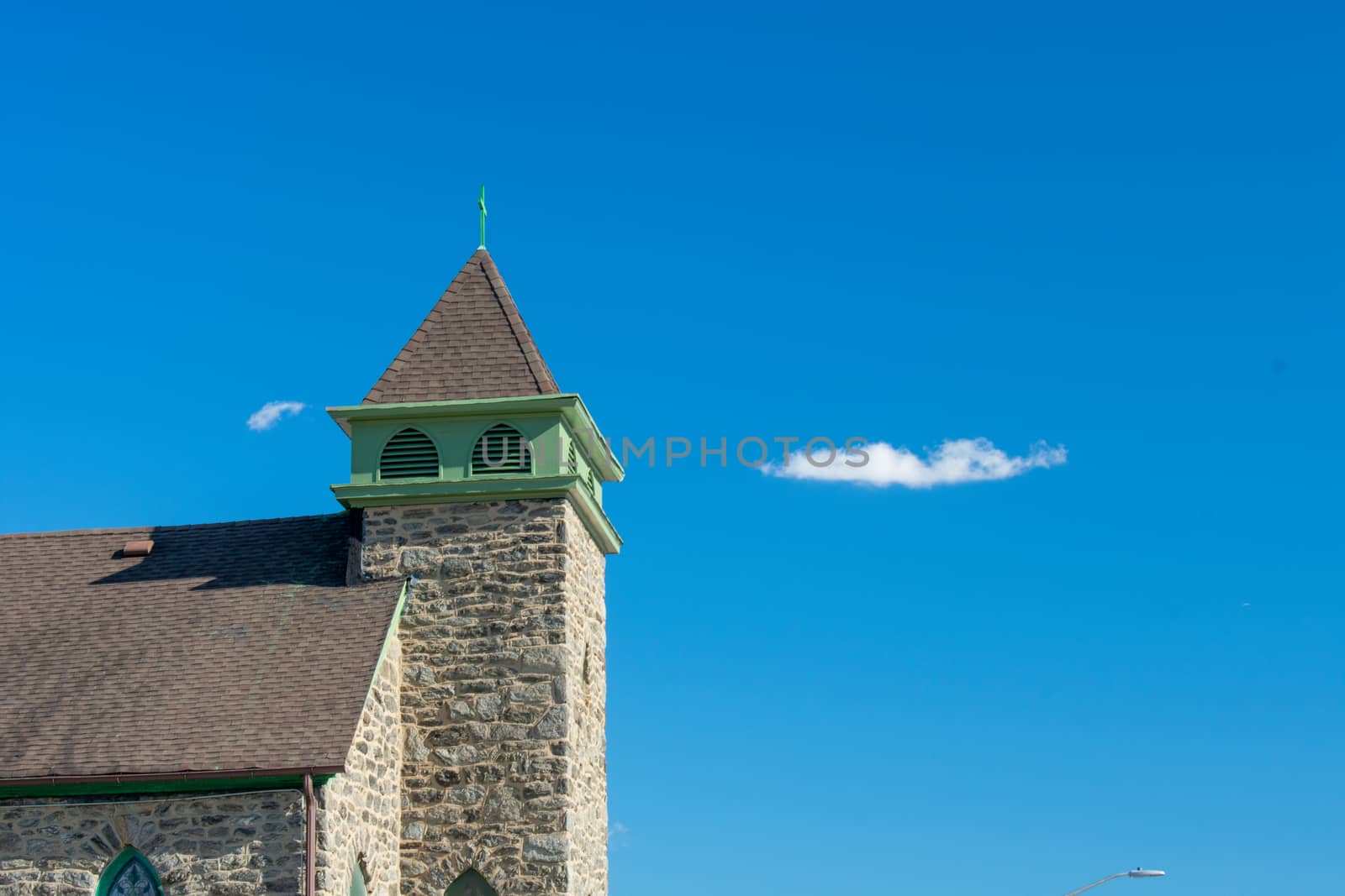 A Detailed Church Tower on a Clear Blue Sky