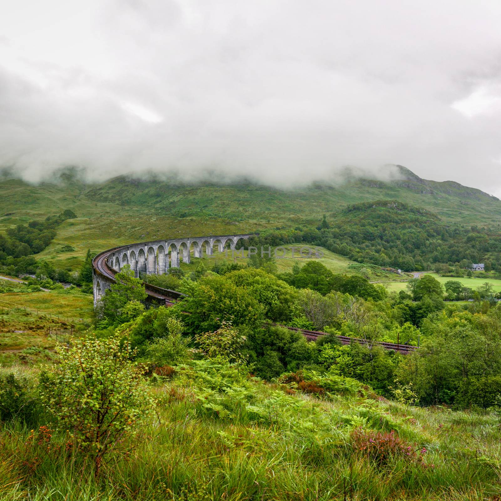 Glenfinnan viaduct in Scotland on overcast day. by Ivanko