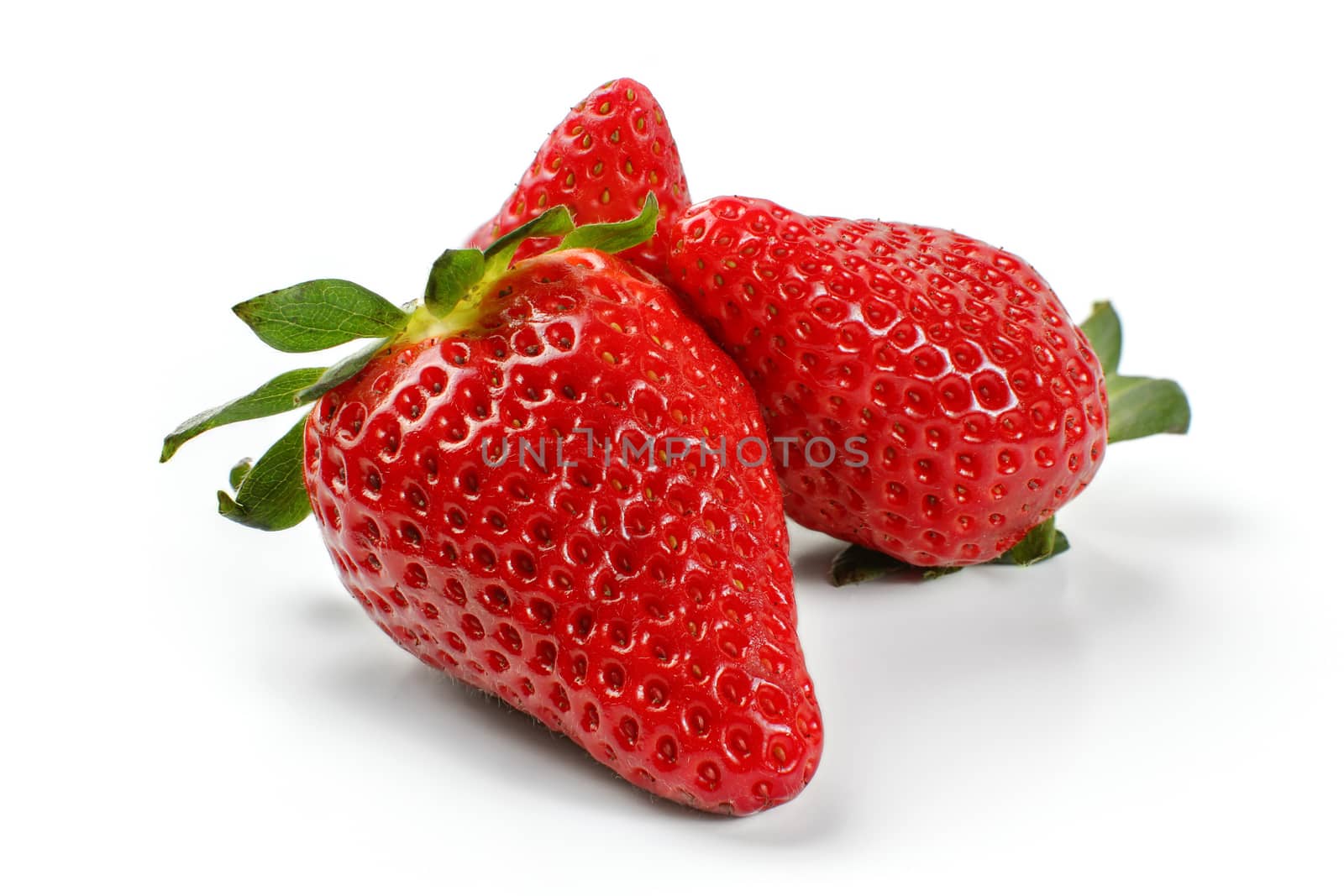 Three strawberries isolated on white background.