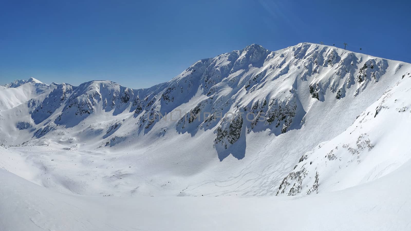 Panorama of Low Tatras with Mount Chopok peak on a sunny winter  by Ivanko