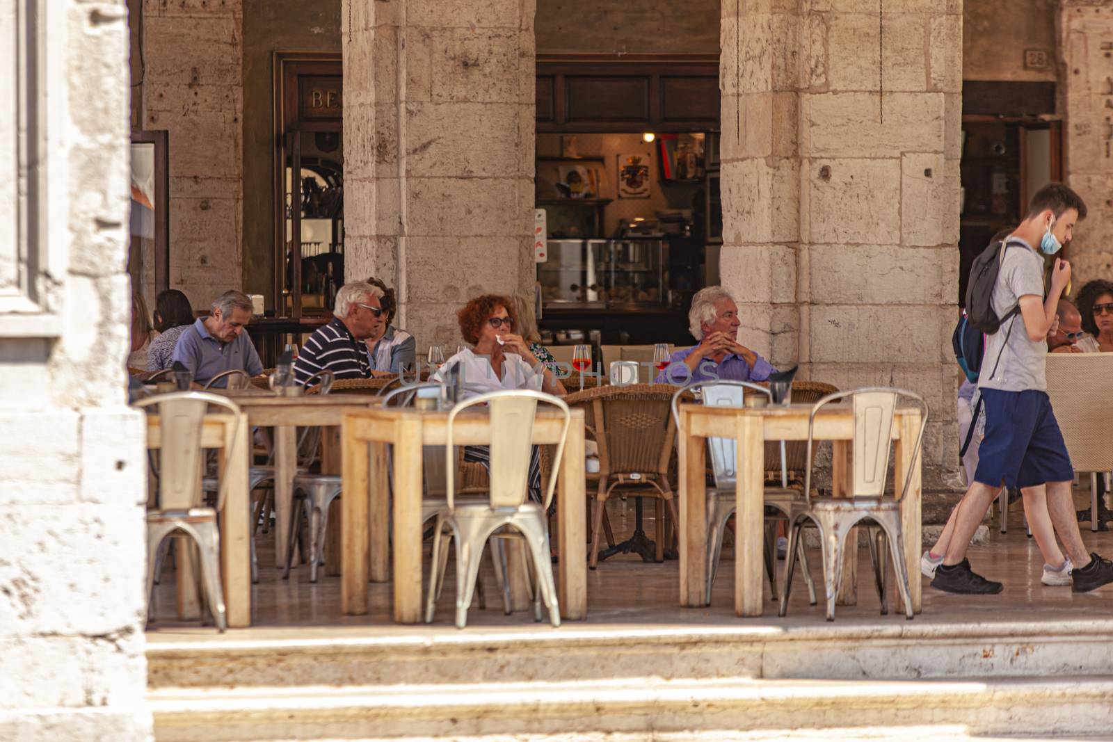 TREVISO, ITALY 13 AUGUST 2020: People sitted at the bar outdoor