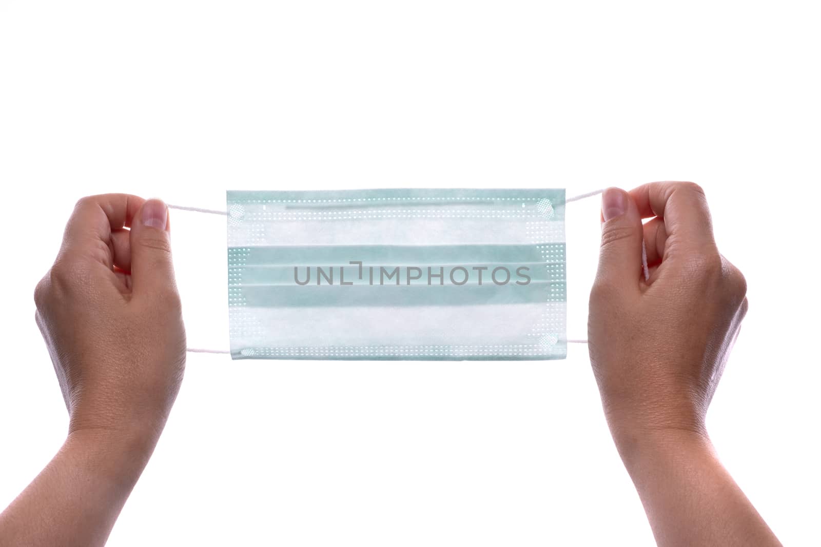 Woman hands holding a protective mask against flu and viruses. Isolated on white background.