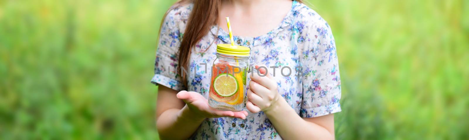 Girl drinking. Fruit water