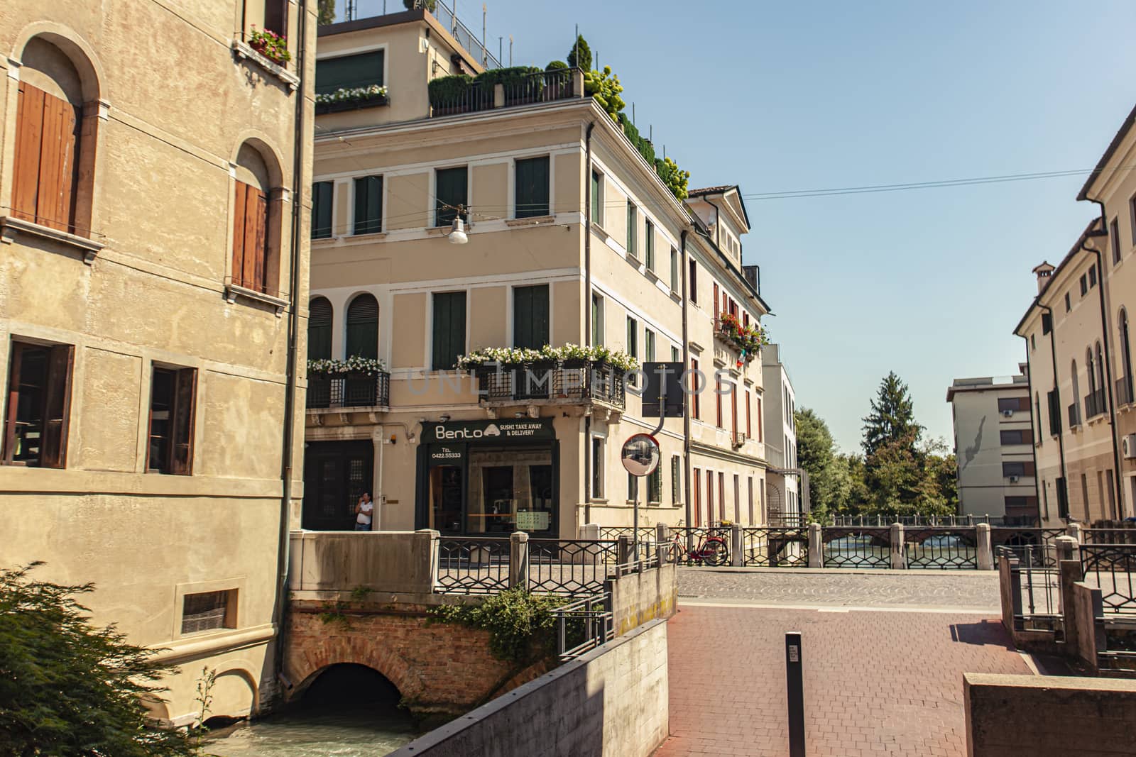 TREVISO, ITALY 13 AUGUST 2020: Bridge on Buranelli canal in Treviso in a Sunny summer day