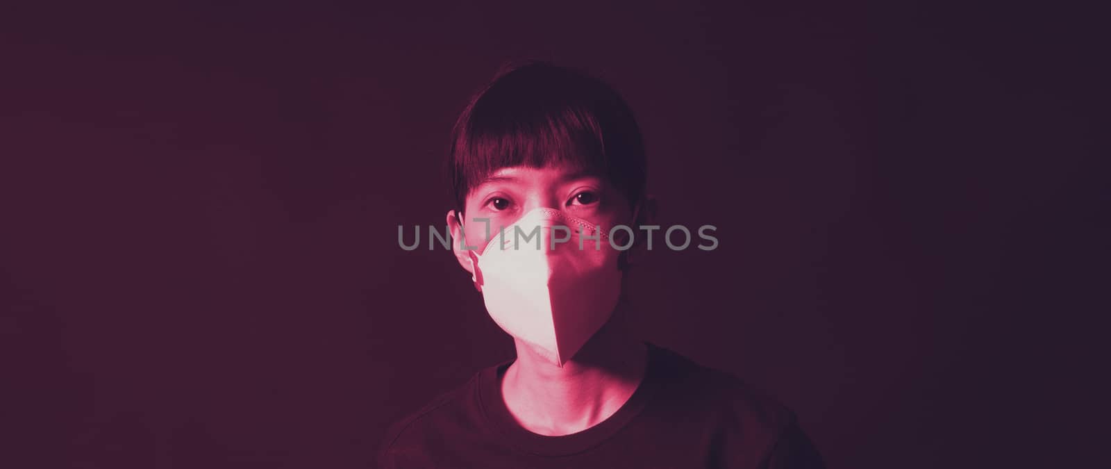 Middle aged of asia chinese woman wearing medical N95 mask  by gnepphoto